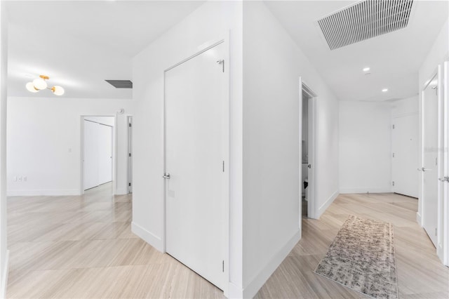 2912 W Santiago St Unit 404, Tampa, FL 33629 - hallway with recessed lighting, baseboards, and light wood finished floors