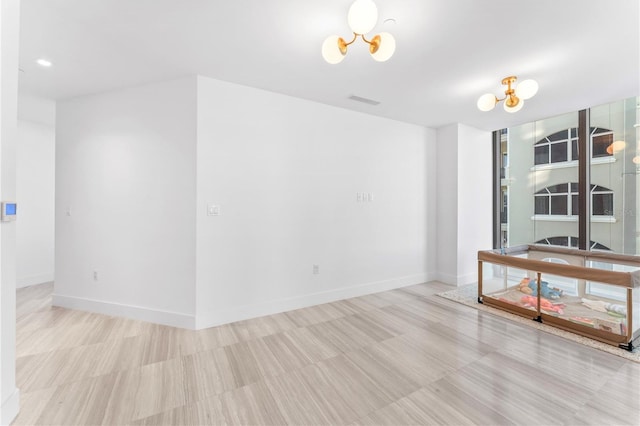 2912 W Santiago St Unit 404, Tampa, FL 33629 - empty room featuring a chandelier, baseboards, and recessed lighting