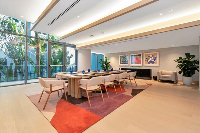 2912 W Santiago St Unit 404, Tampa, FL 33629 - dining area with wood finished floors, floor to ceiling windows, and recessed lighting