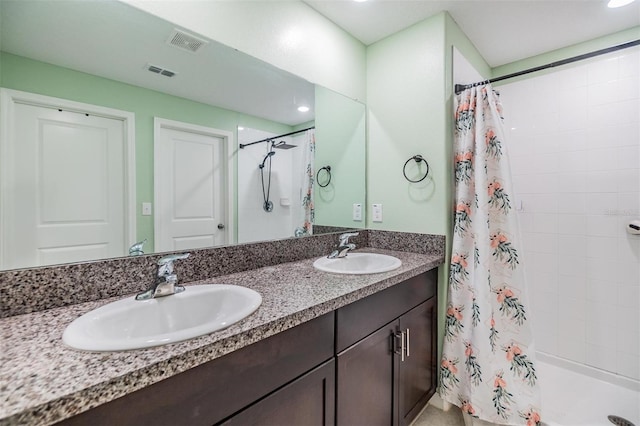 bathroom featuring vanity and walk in shower