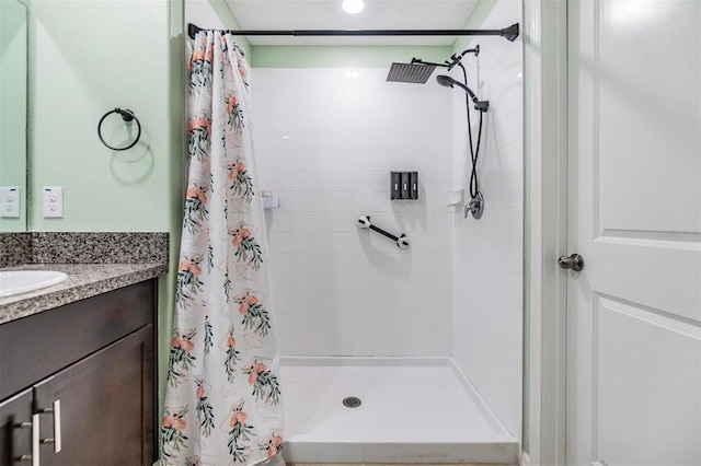 bathroom featuring vanity and walk in shower