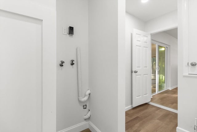 bathroom with hardwood / wood-style flooring