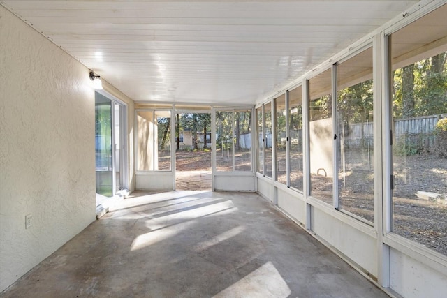 unfurnished sunroom featuring plenty of natural light