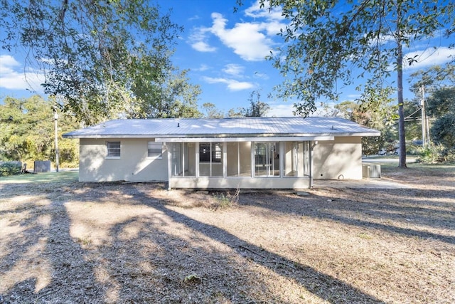 rear view of house with a sunroom