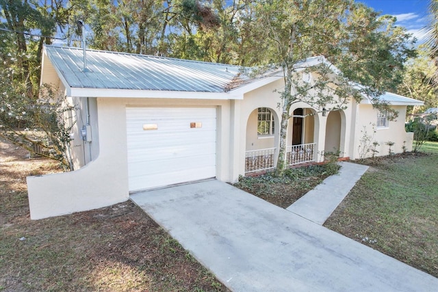 ranch-style house featuring a porch and a garage