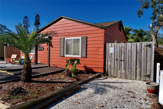 view of side of property featuring a deck