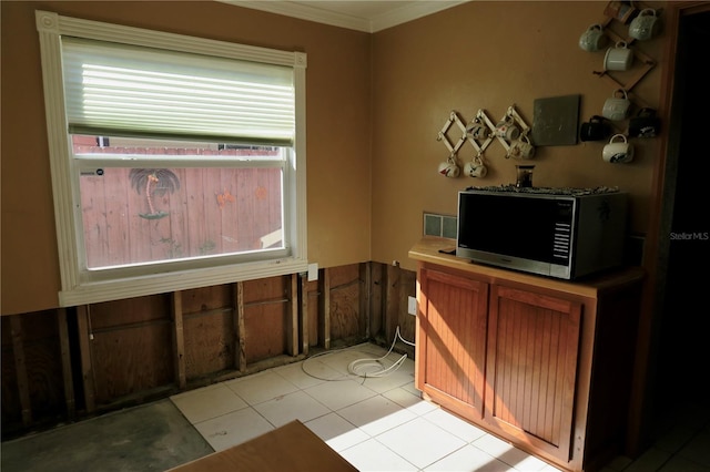 office area with crown molding and light tile patterned floors