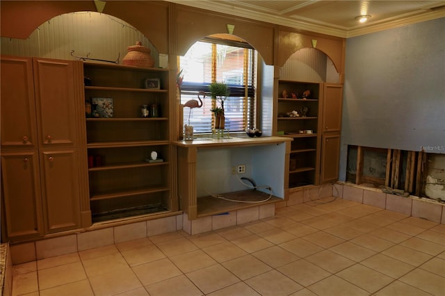 wine cellar featuring light tile patterned floors and ornamental molding