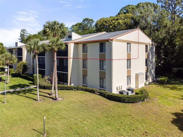 view of building exterior featuring central AC unit