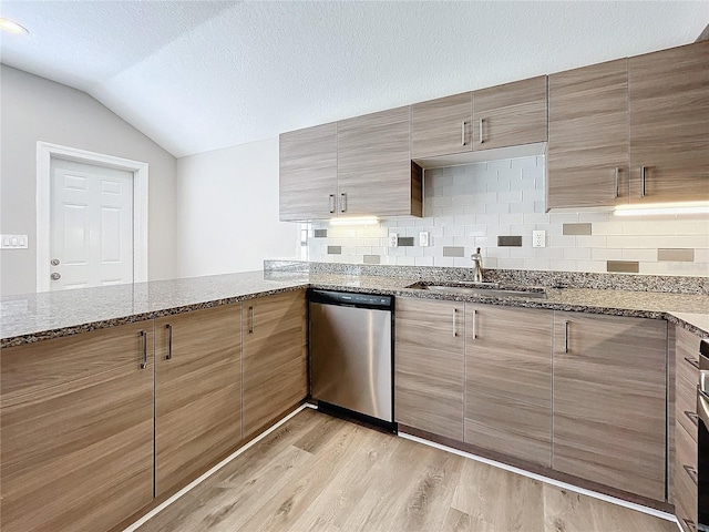 kitchen featuring decorative backsplash, sink, stone counters, dishwasher, and light hardwood / wood-style floors