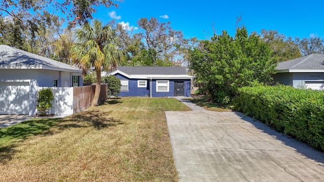 ranch-style home with a front lawn