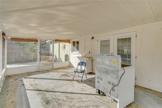 unfurnished sunroom featuring french doors