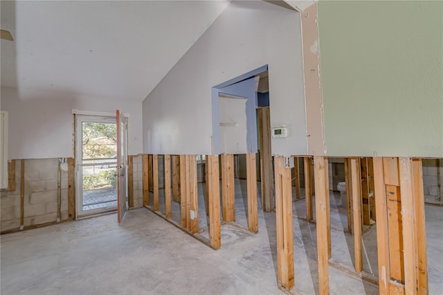 misc room featuring concrete floors and lofted ceiling