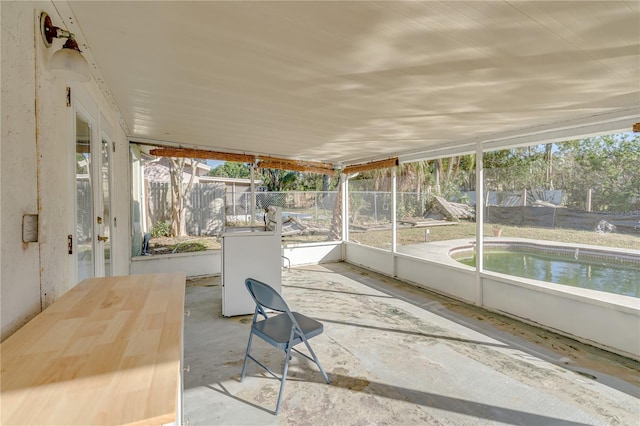 unfurnished sunroom featuring plenty of natural light