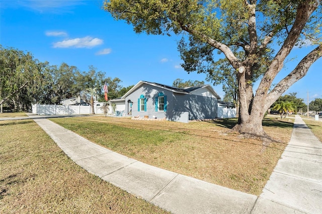 ranch-style home featuring a front yard