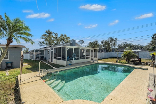 view of pool featuring a lawn and a sunroom