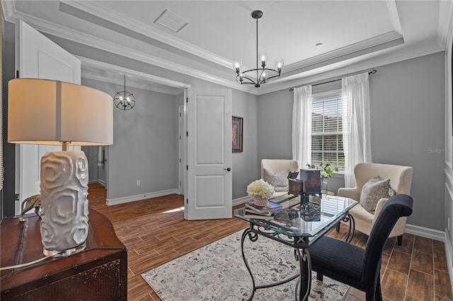 office space featuring dark hardwood / wood-style flooring, a raised ceiling, crown molding, and a notable chandelier