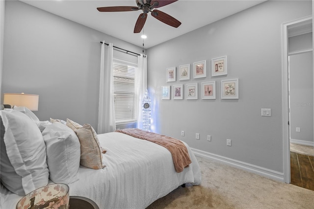 bedroom with ceiling fan and carpet floors