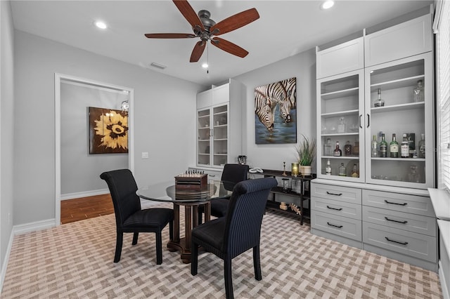 dining area featuring ceiling fan and light hardwood / wood-style flooring