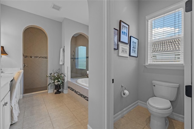 full bathroom featuring vanity, tile patterned flooring, plus walk in shower, and toilet