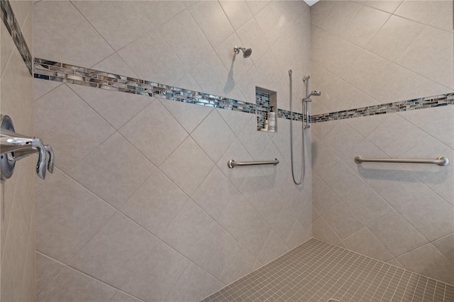 bathroom with a tile shower