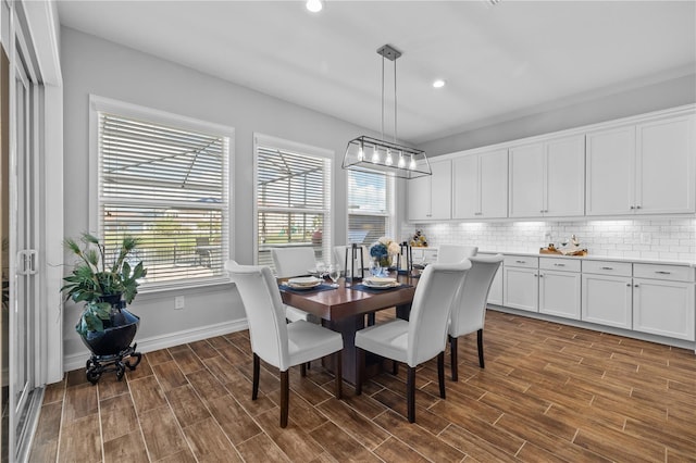 dining room with dark hardwood / wood-style flooring