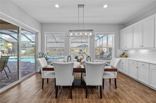 dining room featuring plenty of natural light and hardwood / wood-style flooring