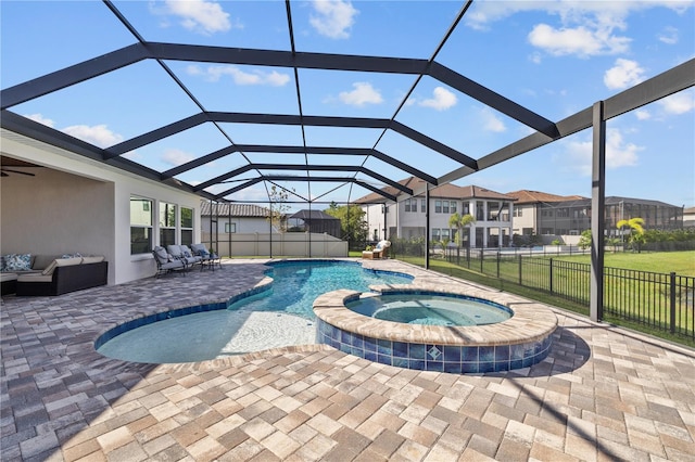 view of swimming pool with an outdoor living space, a lanai, a yard, an in ground hot tub, and a patio