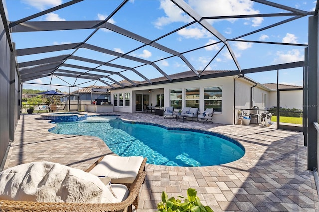 view of pool featuring outdoor lounge area, a lanai, an in ground hot tub, and a patio