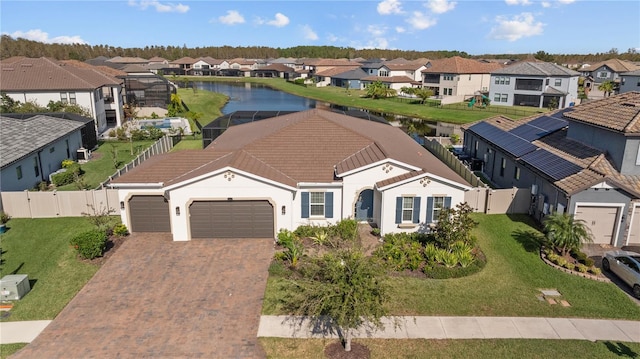 birds eye view of property with a water view