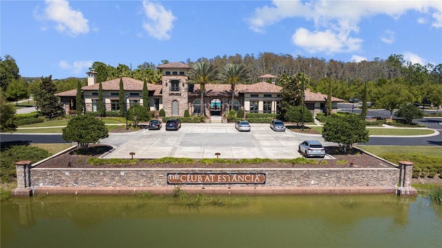 rear view of property featuring a water view