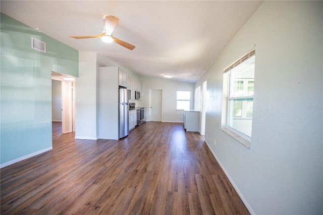 unfurnished living room with dark hardwood / wood-style floors, ceiling fan, and lofted ceiling