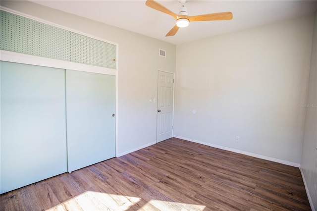 unfurnished bedroom featuring a closet, ceiling fan, and hardwood / wood-style flooring