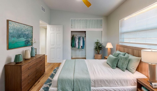 bedroom featuring a closet, vaulted ceiling, ceiling fan, and light hardwood / wood-style floors