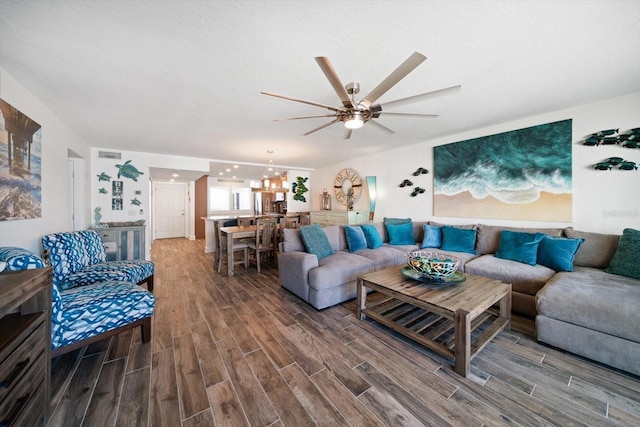 1591 Gulf Blvd Unit 504S, Clearwater Beach, FL 33767 - living room with ceiling fan, wood finished floors, and a chandelier