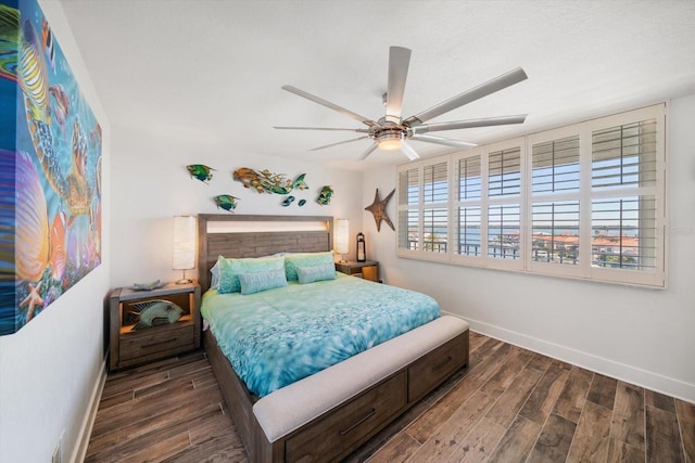 1591 Gulf Blvd Unit 504S, Clearwater Beach, FL 33767 - bedroom with baseboards, wood finished floors, and a ceiling fan