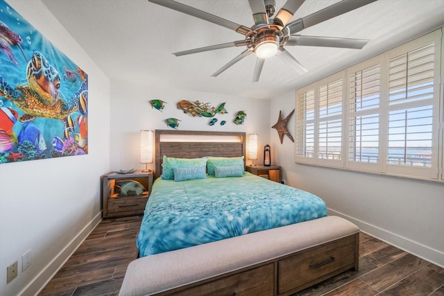 1591 Gulf Blvd Unit 504S, Clearwater Beach, FL 33767 - bedroom with baseboards, dark wood-type flooring, and ceiling fan