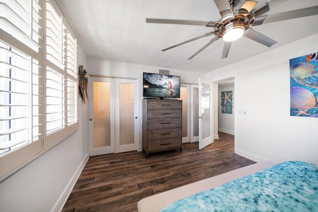 1591 Gulf Blvd Unit 504S, Clearwater Beach, FL 33767 - bedroom with dark wood-style floors, baseboards, and ceiling fan