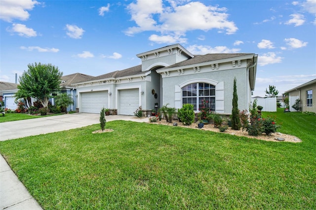 view of front of home featuring a garage and a front yard