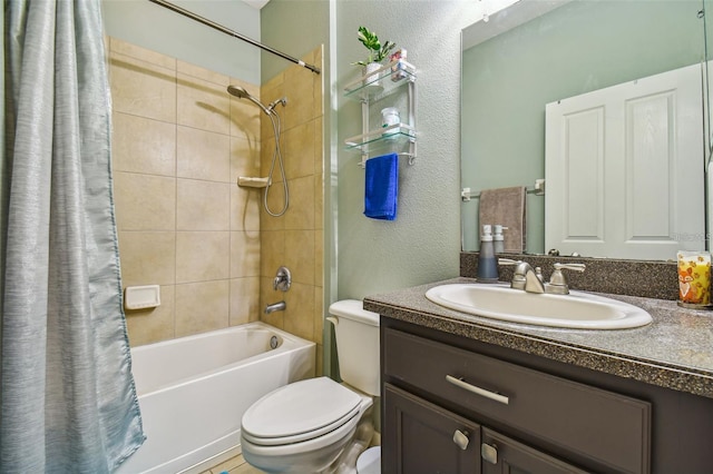 full bathroom with shower / tub combo, vanity, and toilet