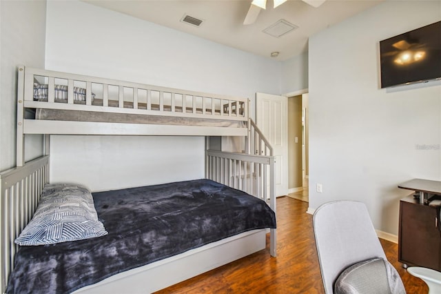 bedroom featuring ceiling fan and dark hardwood / wood-style flooring