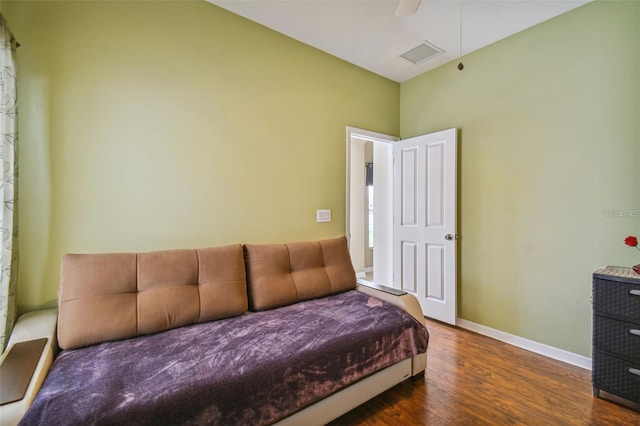 bedroom featuring ceiling fan and dark hardwood / wood-style flooring