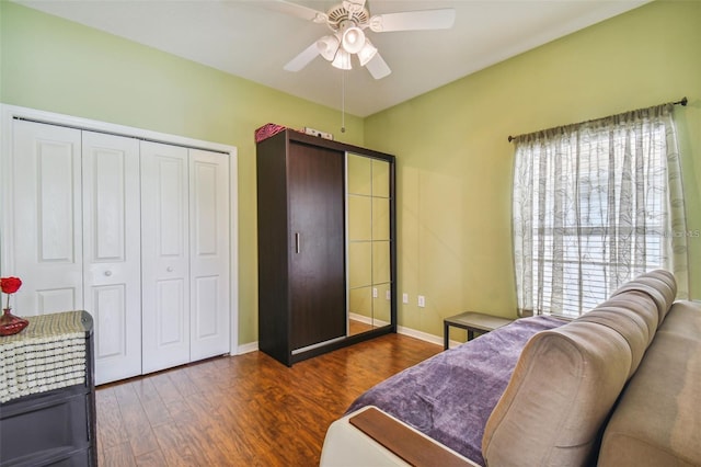 bedroom with ceiling fan and dark wood-type flooring