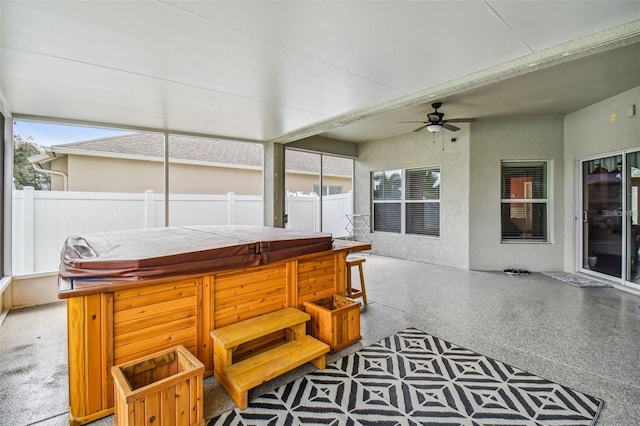 sunroom / solarium with ceiling fan