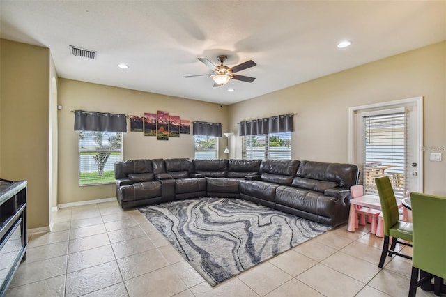 living room featuring ceiling fan and light tile patterned floors