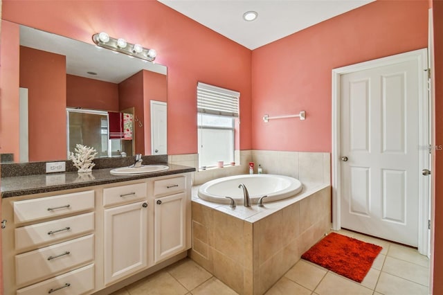 bathroom featuring tile patterned floors, separate shower and tub, and vanity