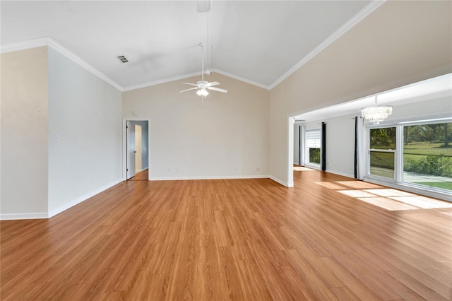 unfurnished living room with ceiling fan with notable chandelier, ornamental molding, high vaulted ceiling, and light hardwood / wood-style flooring