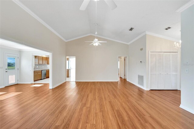 unfurnished living room featuring ceiling fan with notable chandelier, light hardwood / wood-style floors, and ornamental molding