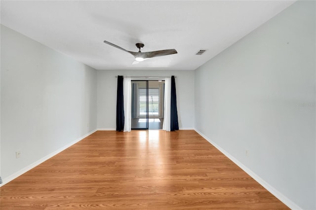 unfurnished room with light hardwood / wood-style floors and ceiling fan