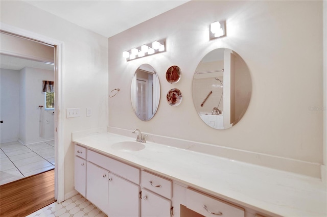 bathroom featuring hardwood / wood-style flooring and vanity